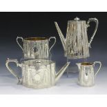 A Victorian silver harlequin four-piece tea set, each piece of shaped oval form, engraved with