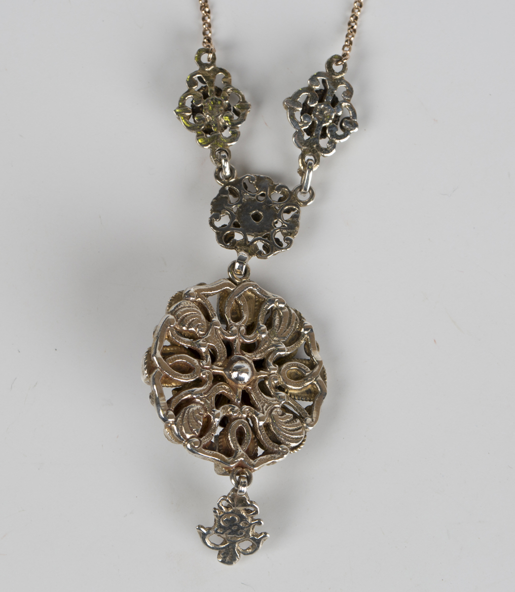 A foil backed garnet, foil backed emerald, cultured pearl and enamelled pendant necklace, probably - Image 2 of 2