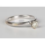 An 18ct white gold and diamond single stone ring, claw set with a circular cut diamond, weight 2.6g,