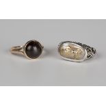 A gold and cabochon dark garnet solitaire ring, detailed '9ct', weight 3.8g, ring size approx P, and