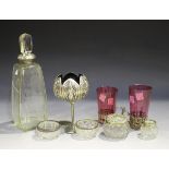 An Art Deco silver mounted cut glass decanter and stopper of square form with tapering canted