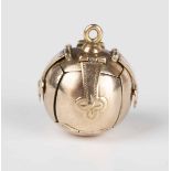 A silver gilt spherical Masonic pendant, the sections hinged to reveal engraved Masonic symbols,