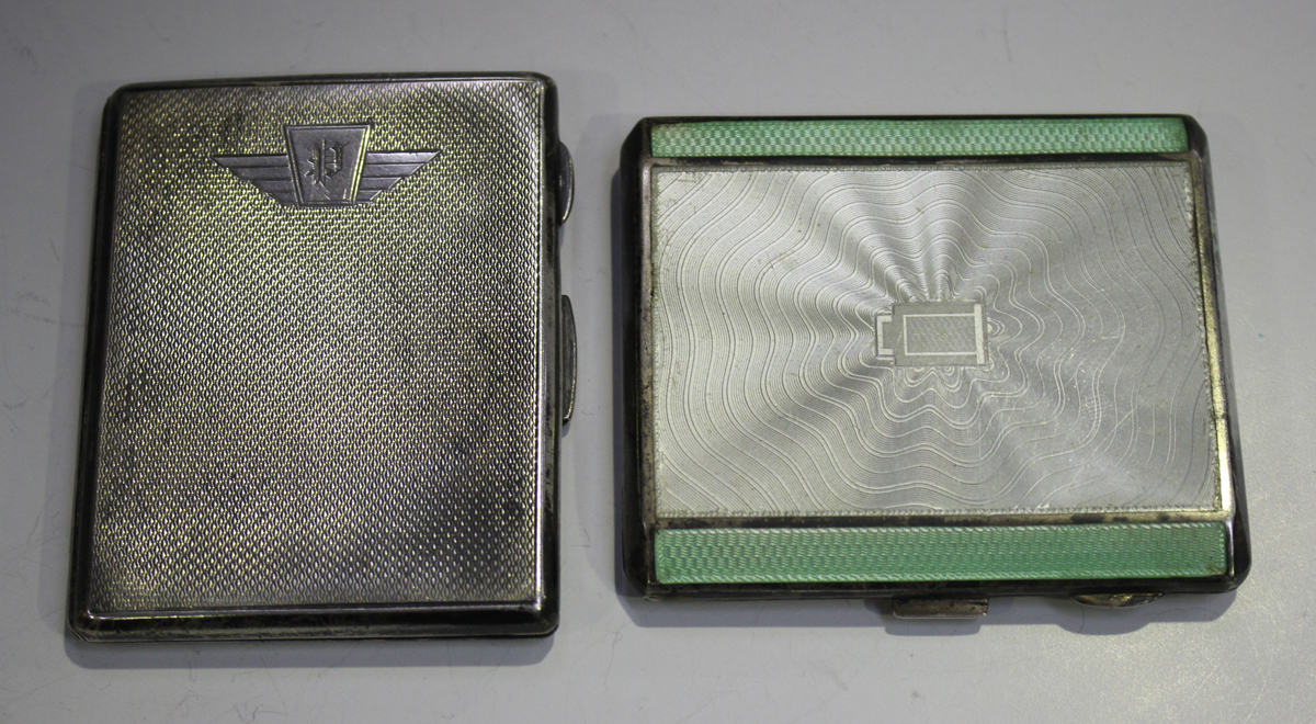 A George V silver and enamelled engine turned rectangular cigarette case, the front with white and