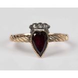 A Georgian style gold and silver set, rose cut diamond and foil backed garnet ring, weight 1.6g,