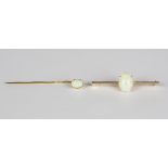 A gold and opal single stone bar brooch, claw set with an oval opal, width 3.8cm, and a gold and