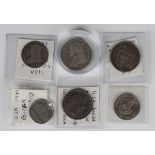 A collection of USA coins, comprising a half-dollar 1836, two further half-dollars, 1875 and 1908 (