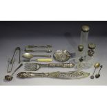 A small group of silver items, including a pair of Victorian fish servers with scroll decoration,
