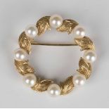 A gold and cultured pearl brooch, designed as a wreath, detailed '14K', weight 5.7g, diameter 3cm.