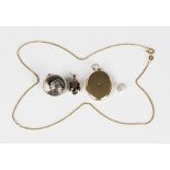 A 9ct gold pendant, claw set with an oval cut smoky quartz, weight 1.5g, length 1.8cm, a gold back