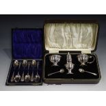 A George V silver five-piece condiment set, comprising pepper caster, circular salt with blue