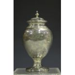 An early Victorian silver pounce pot with pierced dome cover and turned finial, the ovoid body on