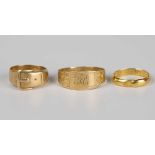 A Chinese gold wedding ring of expandable design, a Victorian 18ct gold ring in a buckle and strap