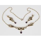 A Scottish 9ct gold and cabochon amethyst necklace in a pierced foliate Art Nouveau inspired design,