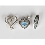 A 9ct white gold and diamond pendant in an open heart shaped design, length 1.7cm, a 9ct white gold,