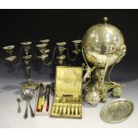A group of plated items, including a pair of twin scroll branch three-light candelabra, height 28.