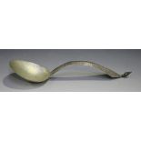 An early 20th century Chinese silver spoon with oval bowl, the curved handle engraved with foliate