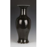 A Chinese dark brown/black glazed porcelain vase, Kangxi period, of baluster form with flared