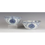 A near pair of Chinese blue and white porcelain bowls, late Ming dynasty, one with mark of