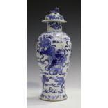 A Chinese blue and white porcelain vase and cover, mark of Kangxi but late 19th century, of baluster