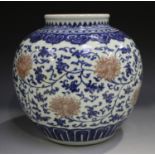 A Chinese Ming style underglaze blue and red porcelain jar, probably 20th century, of stout ovoid