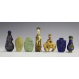 A group of five Chinese snuff bottles, 20th century, including a lapis lazuli bottle with carved