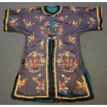 A Chinese blue silk embroidered jacket/short robe, early 20th century, worked in coloured threads