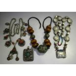 A group of Eastern jewellery, including a Tibetan enamelled and amber bead necklace, length 54cm,