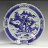 A Chinese blue and white porcelain circular dish, mark of Kangxi but late 19th century, painted with