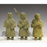 A group of three Chinese tribal carved wood funerary figures, each modelled standing wearing a