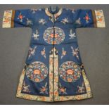 A Chinese blue silk embroidered jacket/robe, early 20th century, finely worked in coloured threads