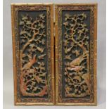 A pair of Chinese carved red lacquered and giltwood rectangular panels, early 20th century, each