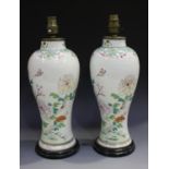 A pair of Chinese famille rose export porcelain vases, Qianlong period, each of baluster form,