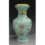 A Chinese famille rose enamelled porcelain vase, late Qing dynasty, of baluster form, moulded in