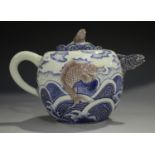 A Japanese underglaze blue and red porcelain teapot and cover by Makuzu Kozan, Meiji period, the