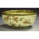 A Japanese Satsuma earthenware circular bowl, early 20th century, the interior painted and gilt with