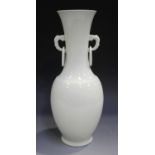 A Chinese white glazed porcelain vase, probably 20th century, the ovoid body beneath a waisted