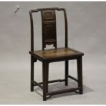 A Chinese hongmu chair, late Qing dynasty, the shaped top rail above a panelled splat back and