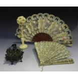 A Chinese Canton export ivory brisé fan, early to mid-19th century, the guards carved in relief with