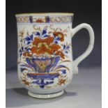 A Chinese Imari export porcelain mug, Qianlong period, the baluster body painted and gilt with