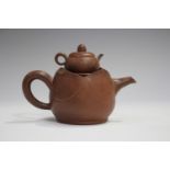 A Chinese Yixing stoneware teapot, 20th century, with cover of diminutive teapot form with lid and