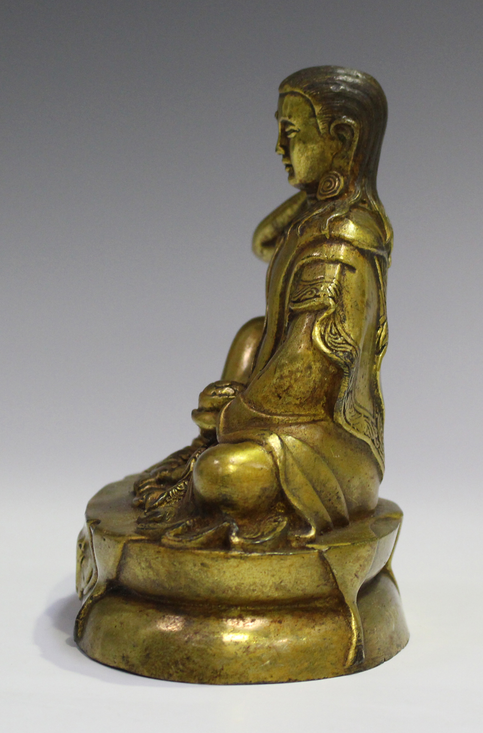 A Sino-Tibetan gilt bronze bodhisattva, probably 20th century, modelled seated on an oval throne, - Image 6 of 8