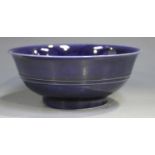 A Chinese blue glazed porcelain bowl, mark of Kangxi but probably 20th century, of flared circular