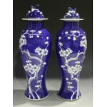 A pair of Chinese blue and white porcelain vases and covers, 20th century, each baluster body and