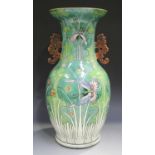 A Chinese famille rose porcelain vase, late Qing dynasty, the baluster body painted with butterflies