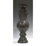 A Japanese brown patinated bronze vase, Meiji period, the globular body cast with landscape panels