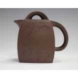 A Chinese Yixing stoneware teapot and cover, late 20th century, of swollen rectangular form, incised