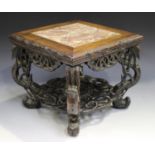 A Chinese hardwood stand, late 19th/early 20th century, the square top inset with a rouge marble