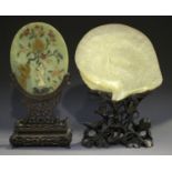 A Chinese Canton export mother-of-pearl shell, late 19th century, finely carved in low relief with