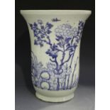 A Chinese blue and white porcelain vase, 20th century, of flared form, painted with flowers, rocks