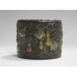 A Japanese mixed metal decorated iron cylindrical pot, Meiji period, cast in relief with a